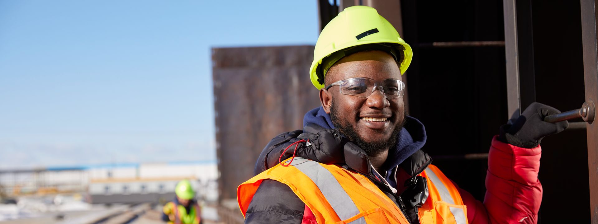 construction worker in safety gear smiling