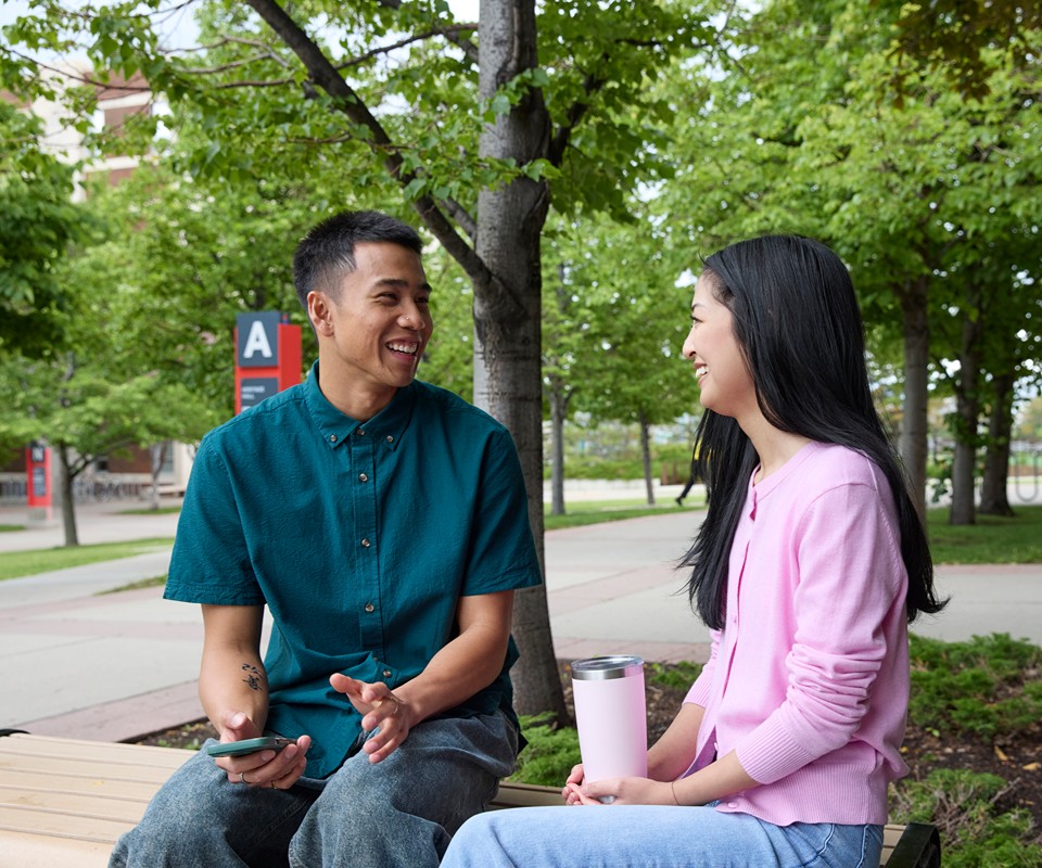 Two students talking outside