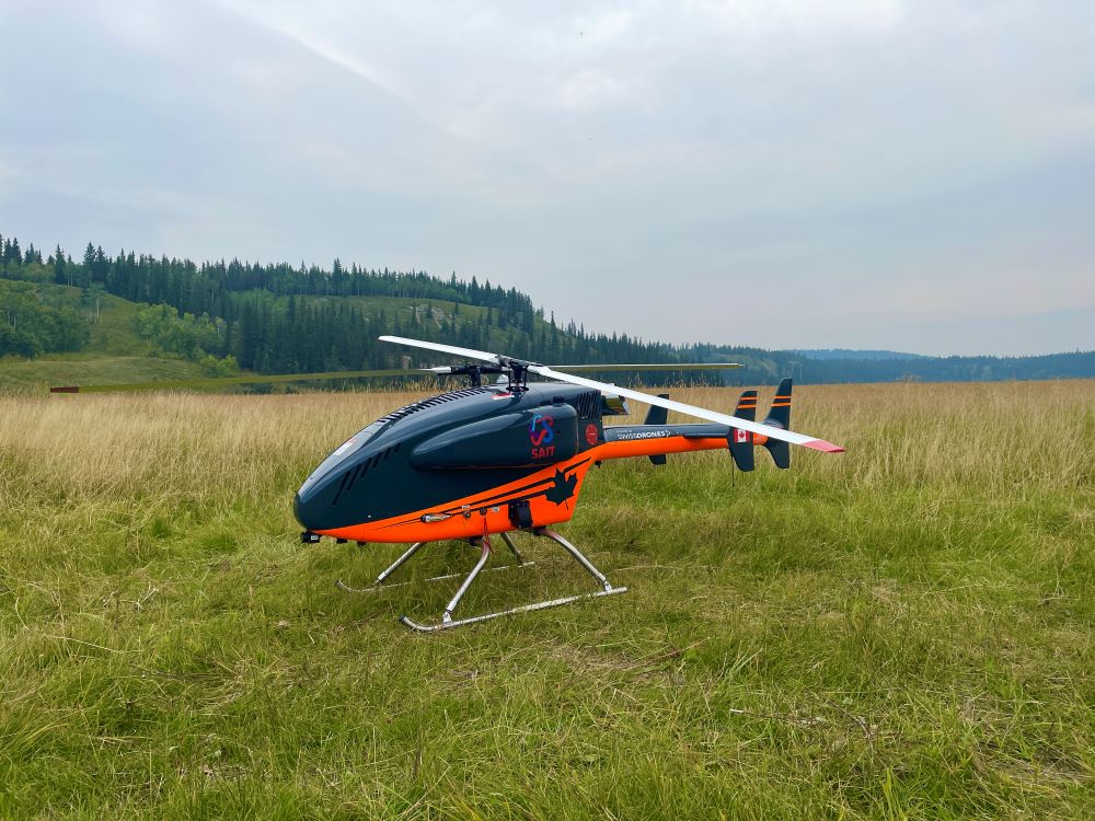 blue and orange drone with the sait logo