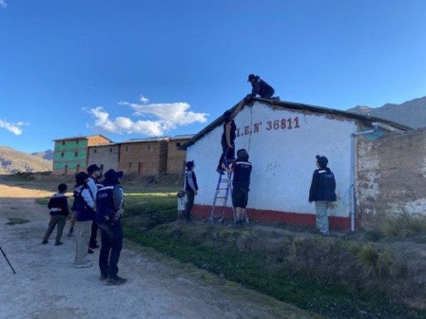 Students standing infront of a building