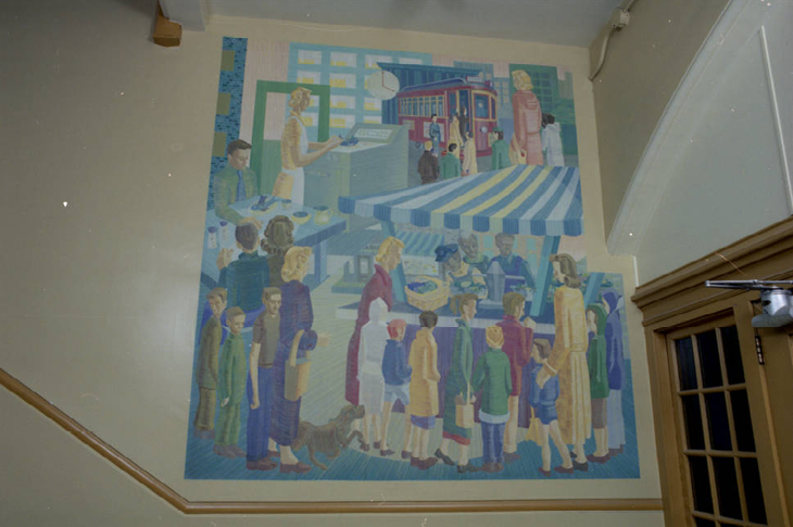 Mural titled City Life can be seen to the left of the doors of the entrance to the second floor from the eastern stairwell in Heritage Hall, 1985.