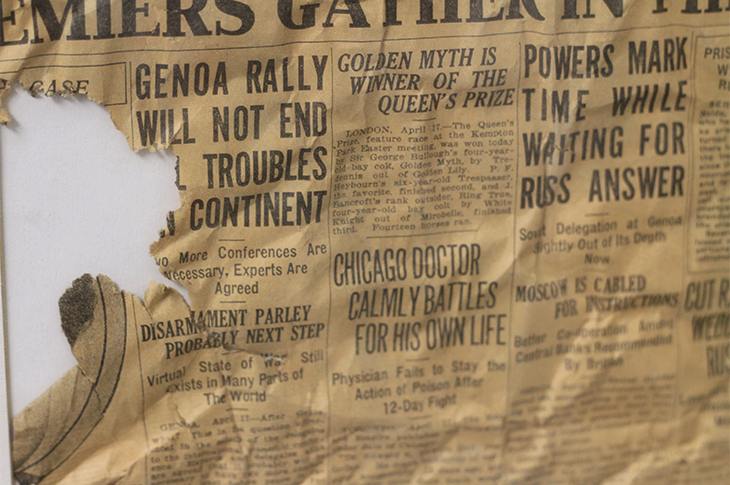 Close up of newspaper that was found within the walls during the 2001 restoration of Heritage Hall.