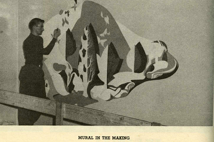 Vintage photo of Henry Bonli (Art '51) painting mural.