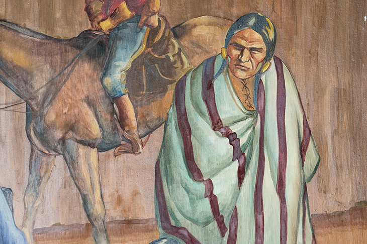 Close up of Indigenous person on mural.