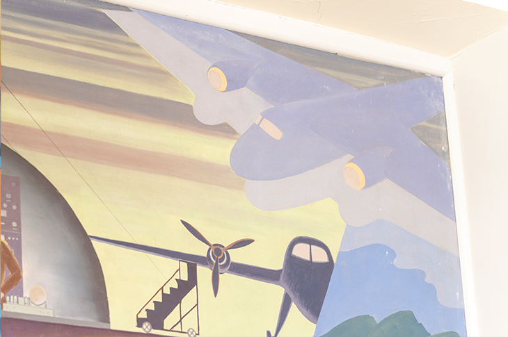 Close up plane on mural.