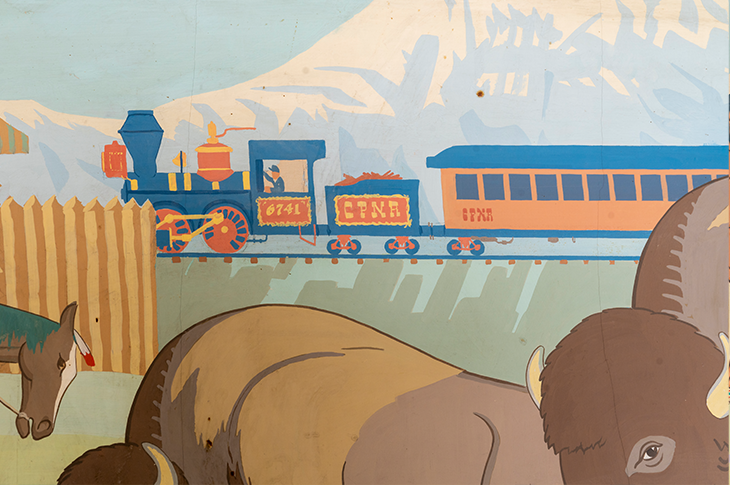 Close up of train on mural.