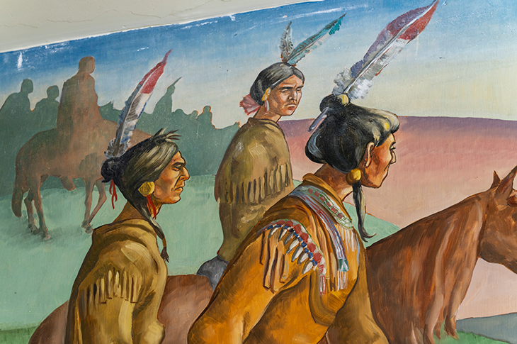 Close up of Indigenous people on mural.