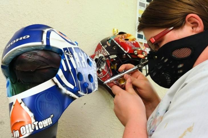 Morgan Schinnour painting a goalie mask