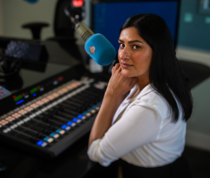 young woman looking at camera in radio studio