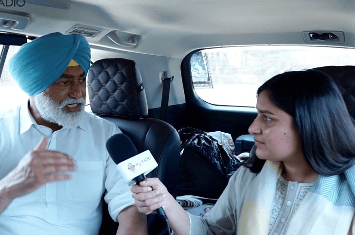 Two people in a car doing an interview