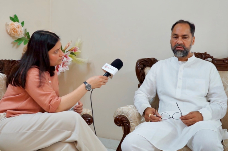 Young woman interviewing an Indian candidate