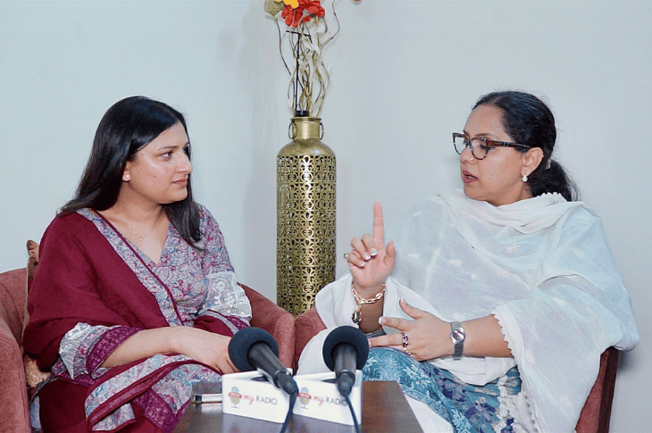 Young woman interviewing a female politician