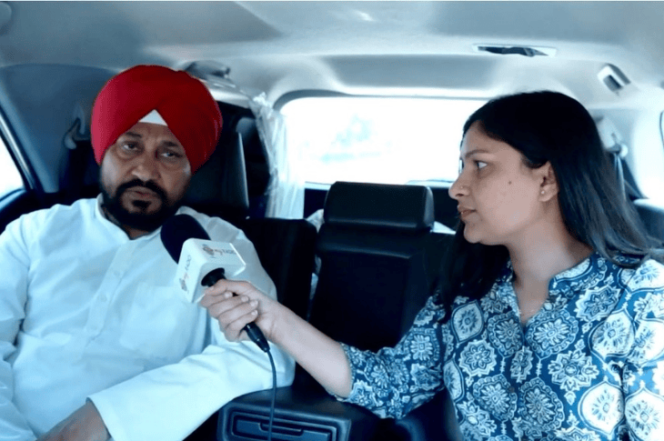 Young woman interviewing a politician