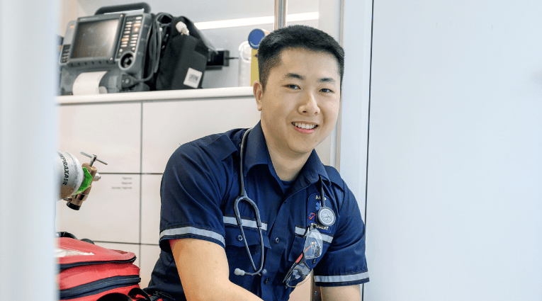 photo of young man in a student paramedic outift