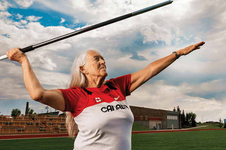 Mature woman preparing to throw a javelin