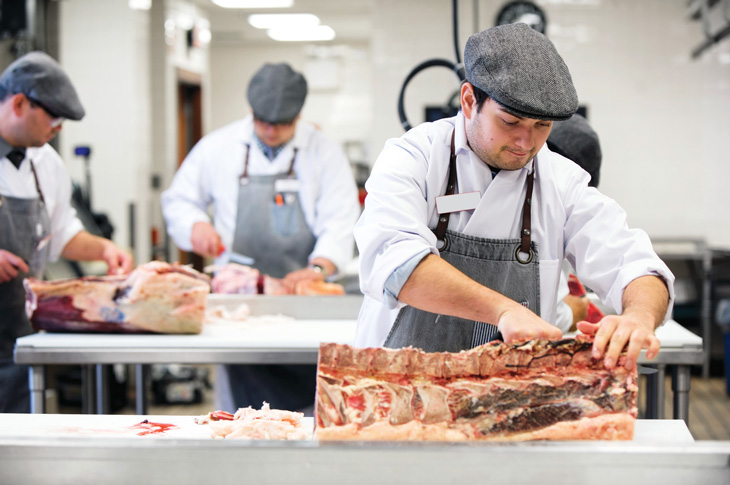 butchery students cutting meat