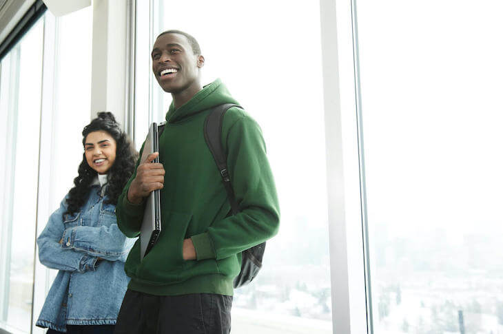 nw-two-people-standing-with-backs-to-glass-window-730x485.jpeg