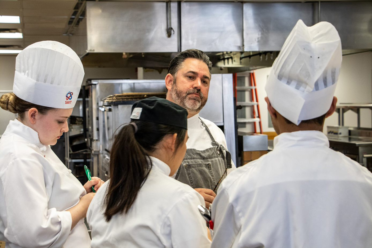 Chef Guas discusses prep for the dish being served at an evening reception.