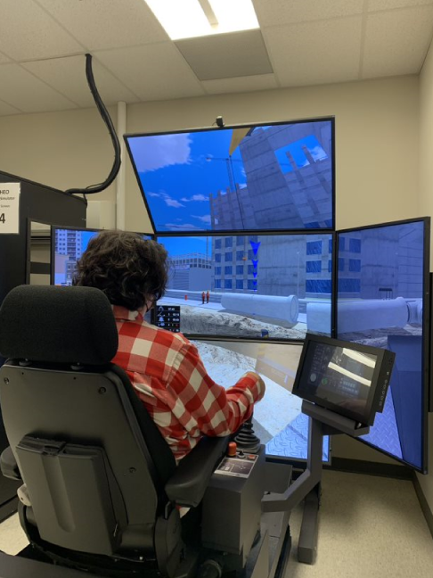 Student uses a crane and hoist operator simulator
