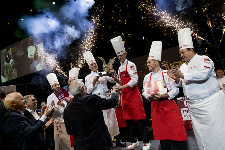 Erik Hansen accepts the Trophée Jean Rougié with sparklers in the background