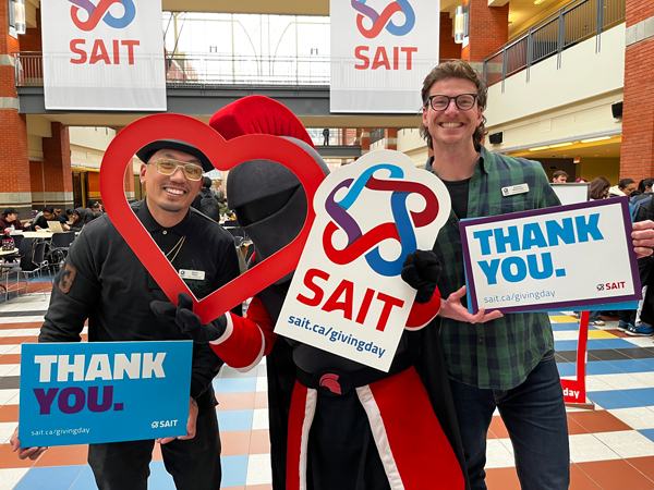 SAIT employees at the Giving Day photobooth