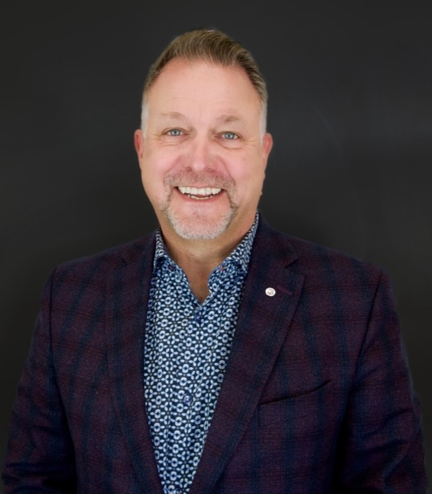 A person smiling for a headshot