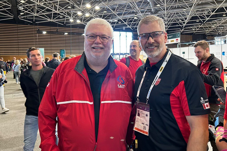 Dr. David Ross and Harold Bergmann pose for a photo at WorldSkills