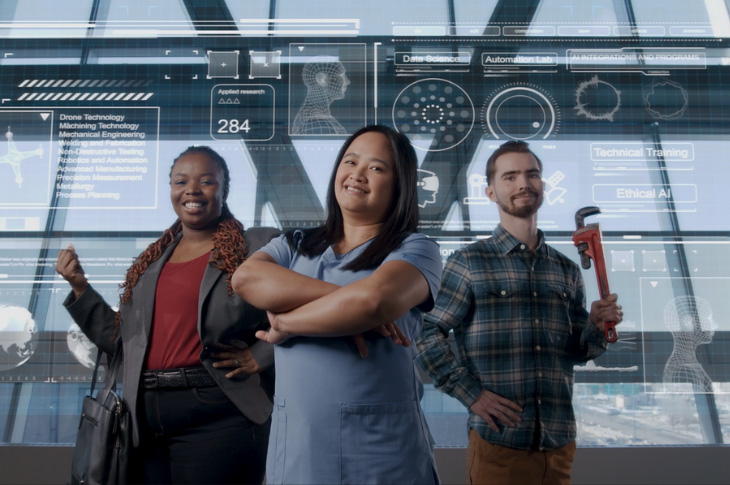 Three students stand as representatives of the future. 