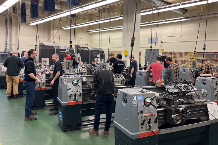 High school teachers learning on machinist equipment at SAIT