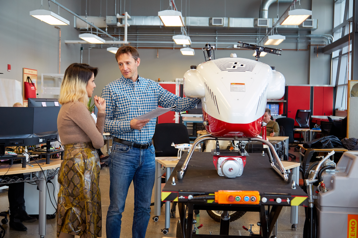 an image of a drone pilot teacher instructing a student at SAIT