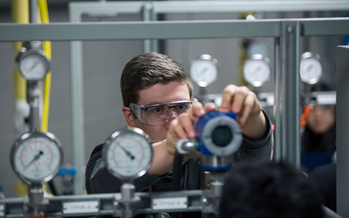 A student works in the Endress + Hauser lab on SAIT campus.
